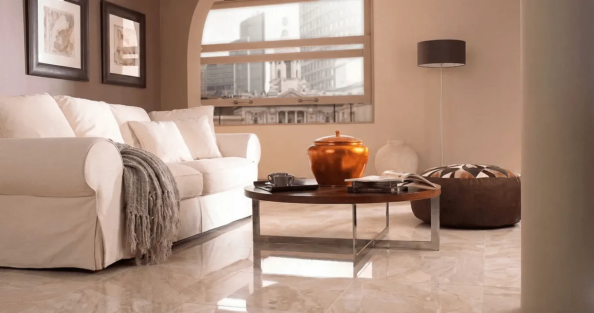 Modern living room with professionally installed marble flooring, a beige sofa, coffee table in Erie, PA